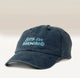 The Sorry I'm Brewing Hat by RAVE COFFEE is a vintage-style cap in dark blue, crafted from soft brushed cotton and featuring light blue embroidered text that says 