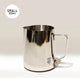 The Crema Pro Milk Steaming Jug or Pitcher, 12 OZ/350ml, has a handle and “SMALL 350ml” labeled in the top left. The Crema Pro logo appears on the lower front of this versatile stainless steel latte art pitcher.
