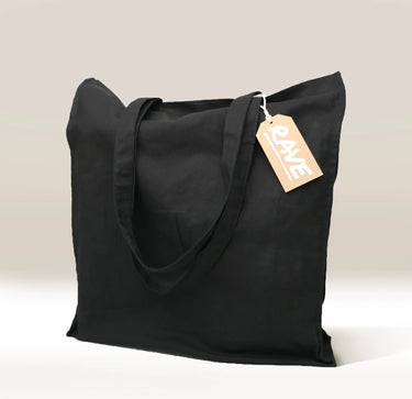 A black Cafe Gift Bag with two handles stands upright. A brown tag reading 