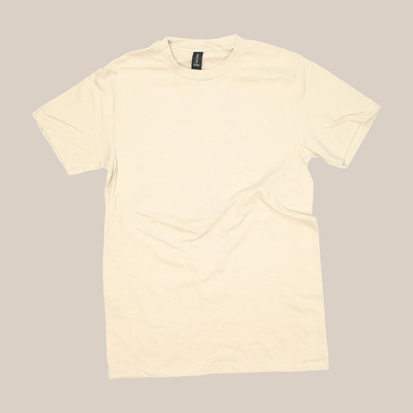 The Rave V60 | T-Shirt by RAVE COFFEE is a beige unisex tee made from sustainable cotton and laid flat on a neutral background. It features a black collar tag with no visible designs or logos, offering a clean, minimalist look.