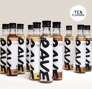Ten bottles of Rave Coffee Syrups in various flavors are arranged in two rows. Each bottle has a white label with RAVE COFFEE in bold black letters. Text in the corner reads TEN FLAVOURS in all caps.