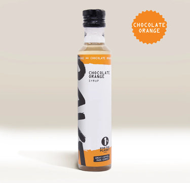 A bottle of RAVE COFFEE Rave Coffee Syrups with a black cap and white label stands on a light background. This UK-blended chocolate orange syrup, perfect for adding to your coffee syrups collection or other flavoured syrups assortments, features an orange badge in the corner that reads CHOCOLATE ORANGE.