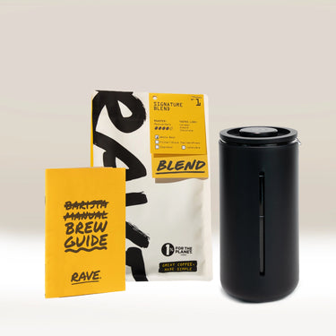 The Timemore French Press Gift Set by Timemore, featuring a yellow brew guide, a bag of freshly roasted coffee blend, and a sleek black travel mug, is arranged side by side on a light surface with a neutral background.