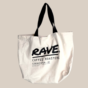 The Rave Co-ordinates Tote Bag by RAVE COFFEE is an eco-friendly white recycled canvas tote with black handles and bold black “RAVE COFFEE ROASTERS, CIRENCESTER, UK” text on the front—perfect for everyday use.
