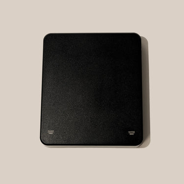 Black USB scales on a beige background
