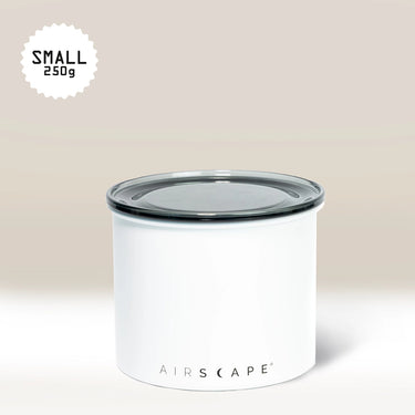 The White Airscape Coffee Storage Container by Planetary Design, featuring Airscape technology and a clear, oxygen-removing lid, labeled SMALL 250g in the top left corner, sits against a light beige background.