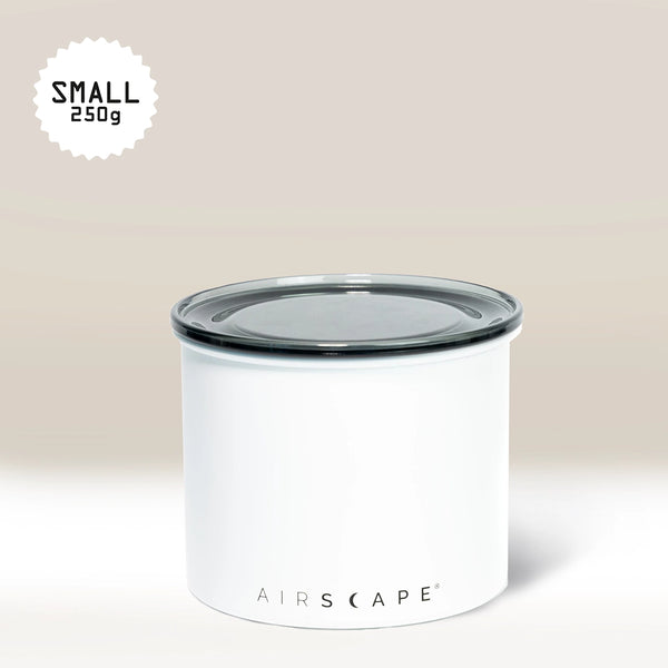 The White Airscape Coffee Storage Container by Planetary Design, featuring Airscape technology and a clear, oxygen-removing lid, labeled SMALL 250g in the top left corner, sits against a light beige background.