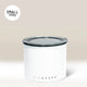 The White Airscape Coffee Storage Container by Planetary Design, featuring Airscape technology and a clear, oxygen-removing lid, labeled SMALL 250g in the top left corner, sits against a light beige background.