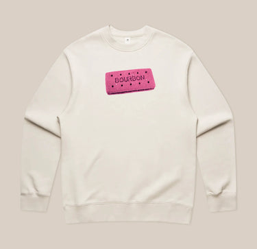 Introducing the Pink Bourbon Sweatshirt from RAVE COFFEE – a limited edition, cream-colored sweatshirt showcasing a playful graphic of a pink rectangular biscuit labeled “BOURBON,” complete with small black dots and centered on the chest. Perfect for anyone looking to express their unique style with a fun twist.