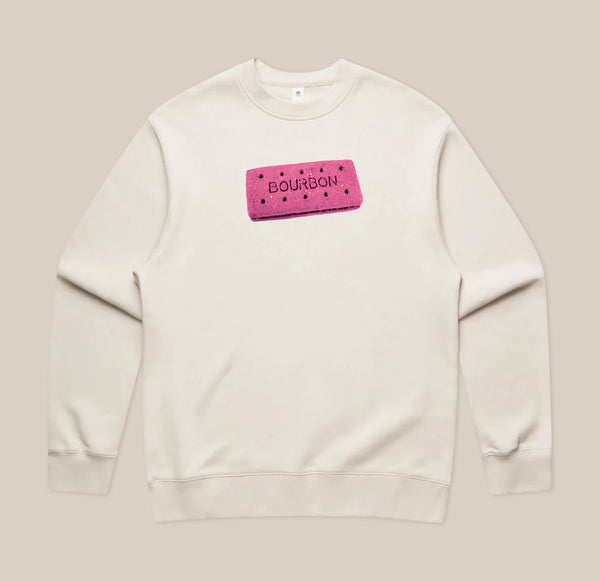 Introducing the Pink Bourbon Sweatshirt from RAVE COFFEE – a limited edition, cream-colored sweatshirt showcasing a playful graphic of a pink rectangular biscuit labeled “BOURBON,” complete with small black dots and centered on the chest. Perfect for anyone looking to express their unique style with a fun twist.
